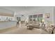 Bright and airy living room featuring large windows and an open concept design at 9565 Sw 194Th Cir, Dunnellon, FL 34432