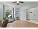 Bright office area with a large window, a ceiling fan, and hardwood floors at 9565 Sw 194Th Cir, Dunnellon, FL 34432