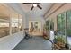 Inviting sunroom with comfortable seating and views, perfect for relaxation and enjoying the outdoors at 9565 Sw 194Th Cir, Dunnellon, FL 34432