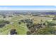 Expansive equestrian property with tracks and stables surrounded by a lush landscape at Lot 8,9,10 Ne 155Th Pl, Citra, FL 32113