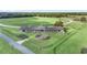Aerial view of horse barn, training pen, and pastureland at Lot 8,9,10 Ne 155Th Pl, Citra, FL 32113