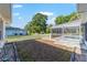 Enclosed backyard with a white picket fence and screened-in pool area at 10140 Sw 81St Terrace Rd, Ocala, FL 34481