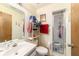 Bathroom featuring a tiled walk-in shower, a single sink, and a standard toilet at 10140 Sw 81St Terrace Rd, Ocala, FL 34481