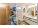 Cozy bathroom featuring open shelving provides storage to maximize space and organization at 10140 Sw 81St Terrace Rd, Ocala, FL 34481