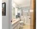 Bright bathroom with walk-in bathtub, stylish vanity, and ample storage space at 10140 Sw 81St Terrace Rd, Ocala, FL 34481