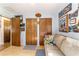 Bedroom with laminate flooring, a ceiling light, and double-door closets for ample storage at 10140 Sw 81St Terrace Rd, Ocala, FL 34481