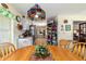 Dining area with a view to the kitchen and living area at 10140 Sw 81St Terrace Rd, Ocala, FL 34481