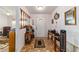 Foyer featuring tiled floors, decorative table, and coat rack, leading into a cozy living space at 10140 Sw 81St Terrace Rd, Ocala, FL 34481