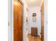 Hallway shows beautiful flooring with natural wood doors, plus decor that adds appeal at 10140 Sw 81St Terrace Rd, Ocala, FL 34481