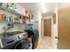 Laundry room with washer, dryer, shelving and tile flooring at 10140 Sw 81St Terrace Rd, Ocala, FL 34481