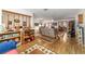 Open living room features wood floors, shelving, and neutral paint at 10140 Sw 81St Terrace Rd, Ocala, FL 34481