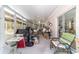 Sunroom featuring large windows for natural light and views of the backyard at 10140 Sw 81St Terrace Rd, Ocala, FL 34481