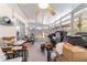 Sunroom featuring large windows for natural light and views of the backyard at 10140 Sw 81St Terrace Rd, Ocala, FL 34481