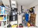 Well-organized utility area featuring an air handler, water heater, and water softener system at 10140 Sw 81St Terrace Rd, Ocala, FL 34481