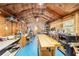 Spacious workshop area with blue floors, work bench, and insulated walls, offering ample room for various projects at 10140 Sw 81St Terrace Rd, Ocala, FL 34481