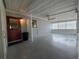 The back porch is screened-in and has an outdoor ceiling fan at 10330 Sw 99Th Ave, Ocala, FL 34481