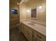 Bathroom vanity with a white sink and tiled floor at 10330 Sw 99Th Ave, Ocala, FL 34481