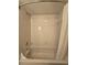 Bathroom with a white tiled shower and tile flooring at 10330 Sw 99Th Ave, Ocala, FL 34481