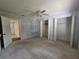 Bedroom with closets and a built-in desk, offering functionality and comfort at 10330 Sw 99Th Ave, Ocala, FL 34481