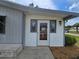 Inviting entryway with decorative glass sidelights and charming exterior details at 10330 Sw 99Th Ave, Ocala, FL 34481