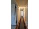 Hallway featuring hardwood floors and neutral wall color at 10330 Sw 99Th Ave, Ocala, FL 34481