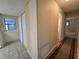 Hallway with tile and wood flooring, closet, and access to other rooms at 10330 Sw 99Th Ave, Ocala, FL 34481