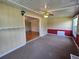 Cozy living room featuring carpet flooring and a classic ceiling fan at 10330 Sw 99Th Ave, Ocala, FL 34481