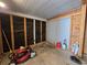 Interior of storage room with lawn equipment and storage closet at 10330 Sw 99Th Ave, Ocala, FL 34481