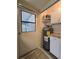 A practical utility area includes a water heater and added storage for efficient home management at 10330 Sw 99Th Ave, Ocala, FL 34481