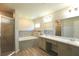 Primary bath with walk-in shower, garden tub and double sink vanity at 11609 Sw 59Th Ter, Ocala, FL 34476