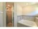 Bathroom features a garden tub and updated fixtures at 11609 Sw 59Th Ter, Ocala, FL 34476