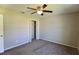 Bedroom with neutral carpet and a walk-in closet at 11609 Sw 59Th Ter, Ocala, FL 34476
