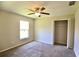 Bedroom with carpet, a closet and a window that allows lots of natural light into the room at 11609 Sw 59Th Ter, Ocala, FL 34476