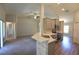 Open-concept kitchen with modern appliances, quartz countertops, and a breakfast bar at 11609 Sw 59Th Ter, Ocala, FL 34476