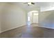 Spacious living room featuring a neutral color scheme, high ceiling, and a ceiling fan at 11609 Sw 59Th Ter, Ocala, FL 34476