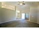 Spacious living room with a ceiling fan and access to other rooms at 11609 Sw 59Th Ter, Ocala, FL 34476
