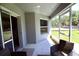 A screened patio area that allows fresh air and protection from outdoor elements at 11609 Sw 59Th Ter, Ocala, FL 34476
