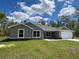 Charming single-story home with a well-manicured lawn and attached two-car garage at 12953 Sw 85Th Pl, Dunnellon, FL 34432
