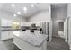 Modern kitchen featuring granite countertops, stainless steel appliances, and a large island at 12953 Sw 85Th Pl, Dunnellon, FL 34432