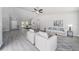 Bright, open-concept living room with wood floors and comfortable seating at 12953 Sw 85Th Pl, Dunnellon, FL 34432