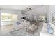 Bright, open-concept living room with wood floors and comfortable seating at 12953 Sw 85Th Pl, Dunnellon, FL 34432