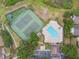 An aerial view of the community playground, pool, tennis courts at 1317 Ravida Woods Dr, Apopka, FL 32703