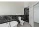 Elegant bathroom showcasing a standalone tub, toilet, and a glass-enclosed shower at 1317 Ravida Woods Dr, Apopka, FL 32703