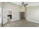 Open plan showing light bedroom with an open door to a bright bathroom at 1317 Ravida Woods Dr, Apopka, FL 32703