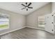 Comfortable bedroom featuring gray vinyl flooring, vaulted ceiling, and bright windows at 1317 Ravida Woods Dr, Apopka, FL 32703
