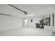 Spacious garage with door to interior and water heater at 1317 Ravida Woods Dr, Apopka, FL 32703