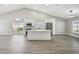 Bright, open kitchen with vaulted ceilings, stainless steel appliances, and a central island for modern living at 1317 Ravida Woods Dr, Apopka, FL 32703