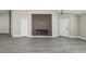 Modern living room with a sleek fireplace and spacious layout; ideal for comfortable living and entertaining at 1317 Ravida Woods Dr, Apopka, FL 32703