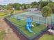 Community playground and tennis courts fenced and ready for outdoor fun at 1317 Ravida Woods Dr, Apopka, FL 32703