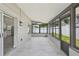Sunroom with many windows allowing view to fenced in backyard at 1317 Ravida Woods Dr, Apopka, FL 32703
